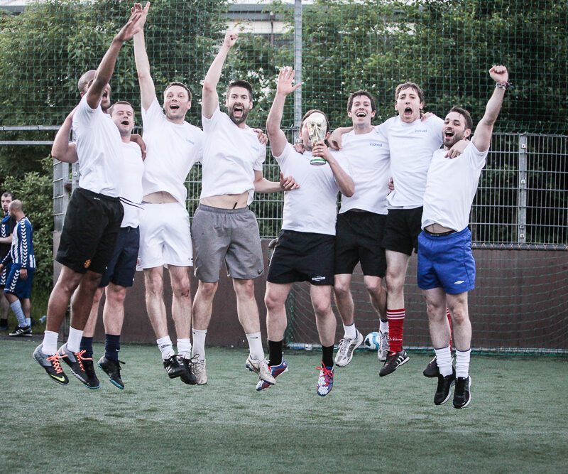 Winning team celebrating their 5-a-side tournament victory.