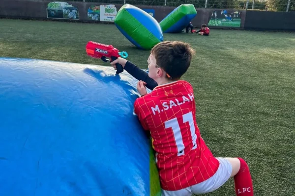 Kid playing in a Nerf AstroWars birthday party